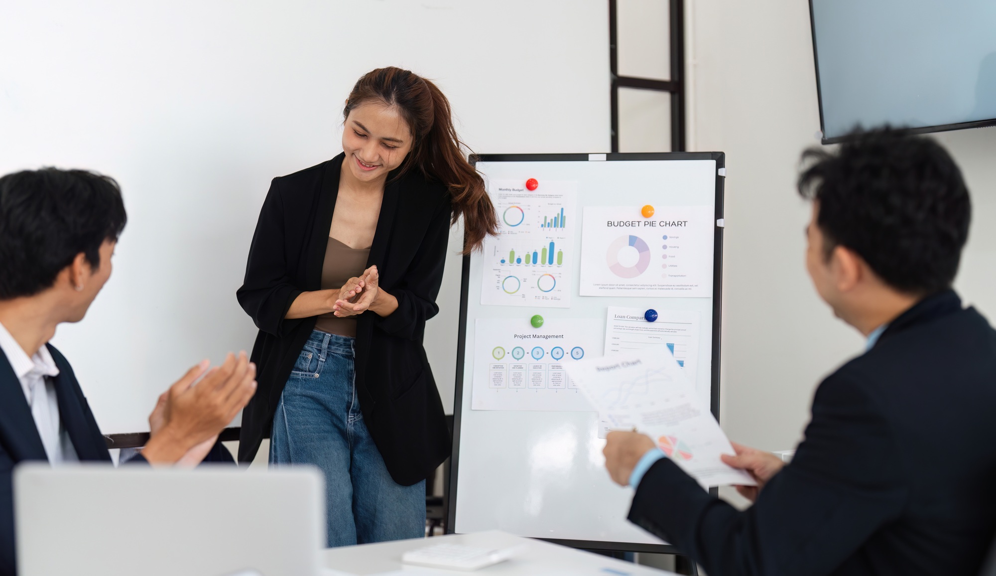 A young woman enjoys the interaction after sharing insights.